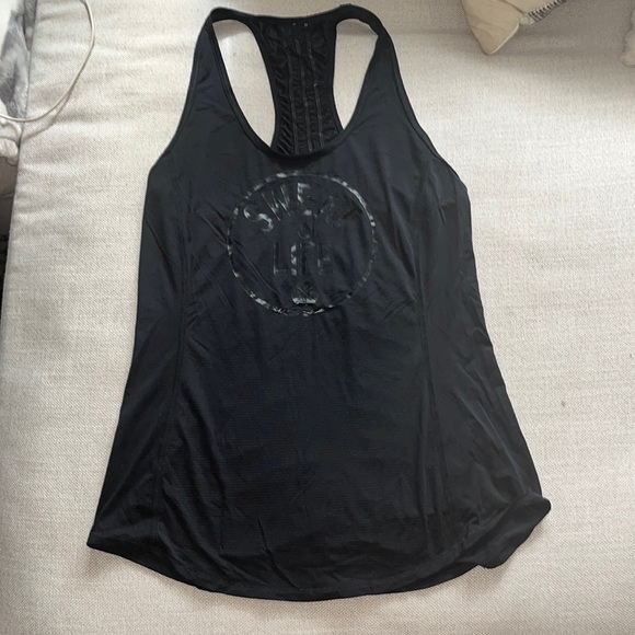 Lululemon tank top. Says “sweat life” very cute back detail. In great condition! - Picture 1 of 3